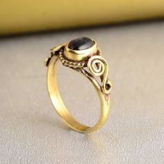 Spiral Black Obsidian Ring in brass, Protection Strength Ring, Minimalist Delicate Ring, personalized gift, handmade gift, gift for her Stone: - obsidian Material: - Brass Size: - Any ♥Please Make Sure to Include The Correct Address During Before Ordering. You Can return the Item within 30 Days After Successful Delivery. We offer a 100% Money Back Guarantee If You are unsatisfied with Your Purchase. Return Charge Will Be Paid By Buyer Only. Thank you for visiting my shop!              jaipurjewe Yellow Gold Brass Moonstone Ring For Gift, Handmade Brass Moonstone Ring In Gold, Hand Forged Brass Rings As Gift, Black Brass Rings For Gift, Gift Brass Moonstone Ring, Gemstone Brass Rings For Gifts, Brass Gemstone Rings For Gift, Hand Forged Spiral Ring For Gift, Hand Forged Spiral Ring As Gift