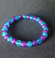 💜 Made with durable, pre-stretched crystal elastic for a perfect fit. 💜 Made with purple and blue 6mm glass beads. 💜 Beautiful in the light. 💜 Slight color variations may occur due to flash used in photography and photo enlargement. 💜 Bracelet will be shipped within 1 to 3 days except holidays. 📬 💜 If you have any questions, please don't hesitate to contact me. I will do my best to reply as soon as possible. Hypoallergenic Turquoise Stretch Bracelet Gift, Blue And Purple Bracelet, Turquoise Stretch Bracelet As A Gift, Turquoise Stretch Bracelet As Gift, Faceted Beads Stretch Bracelet Gift, Handmade Blue Stretch Bracelet For Birthday, Hypoallergenic Blue Beaded Bracelets For Birthday, Hypoallergenic Blue Beaded Bracelets For Birthdays, Blue Hypoallergenic Crystal Bracelet As Gift