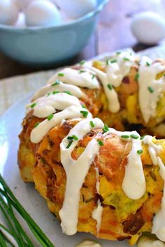 a bundt cake with white icing and green sprinkles on a plate