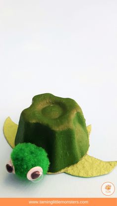 a paper mache turtle made out of green stuff