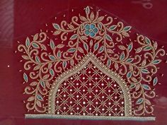 an intricately designed red cloth with gold and blue beads on the edges, is displayed