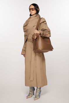 <div>Micro tote bag is adorned with twisted musubi knots on each side, inspired by traditional Japanese obi sashes. Crafted from soft leather, detailed with an embossed Acne Studios logo.</div> Trenchcoat Outfits, Men Shoes With Jeans, Capsule Wardrobe Basics, Tan Bag, Leather Heeled Boots