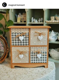 a small wooden chest with hearts on it