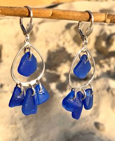 "Top quality cobalt blue sea glass from Puerto Rico are brought to life in a beautiful chandelier earring setting. This design and colors are very desired, and they always sell out when i have them in stock at sea glass festivals. cobalt blue are considered rare colors and it is very hard and time consuming to collect enough sea glass pieces in similar size and shape to create this amazing earrings. Each sea glass piece is carefully hand drilled. They are so much fun and lots of sparkling. One o Nickel Free Blue Recycled Glass Jewelry, Blue Sea Glass Nickel Free Earrings, Blue Teardrop Sterling Silver Chandelier Earrings, Blue Teardrop Sea Glass Jewelry, Blue Teardrop Recycled Glass Jewelry, Elegant Blue Sea Glass Jewelry, Blue Teardrop Sea Glass Earrings, Handmade Blue Sea Glass Earrings, Blue Recycled Glass Dangle Earrings