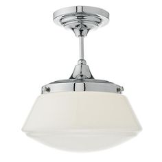 a chrome ceiling light with a white shade