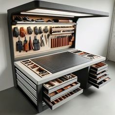 a workbench with many drawers and lots of tools in it's storage compartment