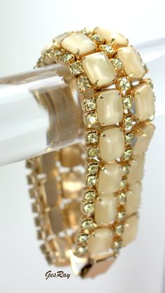 "It is gold tone with prong set soft yellow clear and Moon Glow rhinestones. The bracelet is almost 6.5\"\" long and 1\" wide with the flip over clasp, which works well. The weight of this one is 1.8 oz. Condition: no missing stones, no defects. It is a vintage item in excellent condition. Multiple Jewelry International shipping discount: 1-7 pieces of Single Jewelry = $19.99. We combine shipping, If you want to take advantage of the reduced shipping you must contact us before you pay for your i 1950s Jewelry Style, 1950s Jewelry, Rhinestone Jewelry Set, Vintage Rhinestone Jewelry, Set Bracelet, Vintage Gothic, Soft Yellow, Glass Pendant Necklace, Moon Glow