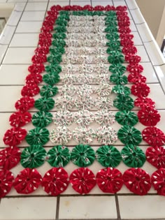 a table with red, green and white bows on it