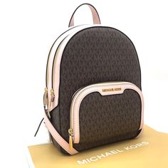 Brand New With Tag Color: Brown/Powder Blush Gold Tone Hardware Michael Kors Jaycee Medium Backpack Backpack Logo-Print Canvas 89.4% Coated Canvas/9.6% Polyester/1% Polyurethane Trim: 60% Polyurethane /20% Polyester/ 20% Cotton Gold-Tone Hardware 8.75"W X 12"H X 4.25"D Exterior Details: Front Zip Pocket Interior Details: Back Zip Pocket, Tech Compartment, Front Slip Pocket Lining: 100% Polyester Zip Fastening Imported Michael Kors Pink Travel Backpack, Michael Kors Pink Backpack For Everyday, Pink Michael Kors Backpack For Travel, Michael Kors Mini Backpack, Dream Items, Studded Backpack, Michael Kors Backpack, Flap Backpack, Blush Gold