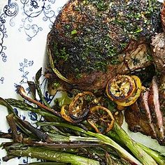 a plate with steak and asparagus on it