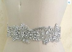 "Sale, Reg. $168.00. A stunning, elegant haute couture wedding sash is exquisitely beaded in beautiful vintage pattern finished in unique asymmetrical edge through out. The entire all hand-made beading is 2.5 inches at the widest point and densely packed with countless finest austrian crystals, ivory pearls and silver beads creating a brilliant gleaming sparkles. Your choice of 1.5 inch wide ribbon is sewn on the beading and ties at the back into a bow, or the beading can be sewn directly onto t Elegant Haute Couture, Slim Wedding Dresses, Bride Sash, Haute Couture Wedding, Beaded Wedding Dress, Bride To Be Sash, Luxury Brides, Wedding Dress Belt, Wedding Sash Belt