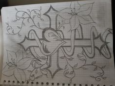 a drawing of an anchor and flowers on a piece of paper with the word faith written in cursive writing