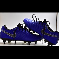 a pair of blue and black soccer cleats