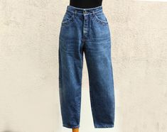 "Vintage 80's Jeans women's / Mom Jeans women's / High Waist Jeans women's / made in Italy Jeans women's   Label Size: USA 30, I 46, EUR 40 Please look the actual measurements in description which are taken by hand and thus show the actual size. Measurements (lying flat): Waist: 38.7 cm / 15 1/4\"   From crotch to waist line: 29.2 cm / 11.5\" Hips: 53.2 cm / 21\" Inseam legs: 67.2 cm / 26.5\" Material: 100% cotton Condition: great Vintage  N.B. Color may slightly differ from picture Made in Italy Please check measurements to insure a proper fit. Remember to allow yourself some extra room for movement. You can compare these with something from your closet that fits you well. SHIPPING * I ship worldwide via Priority mail (Latvijas Pasts) from Latvia (EU). * I ship from Europe, so please allo 80s Jeans, Jeans Mom, Label Sizes, High Waist Jeans, Mom Jeans, Women Jeans, High Waisted, Clothes For Women, Clothes