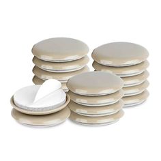 a stack of white plates sitting next to each other