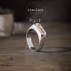 Discover timeless elegance with our Customizable Sterling Silver Men's Ring. This unique piece is designed with a sleek rectangular side profile, crafted from premium 925 sterling silver. The standout feature of this ring is its customizable area, perfect for engraving a name, monogram, initials, logo, symbol, or signature, making it a truly personalized accessory. Key Features: Material: 925 Sterling Silver Customizable with name, initials, monogram, logo, symbol, or signature Sleek rectangular Classic Rectangular Signet Ring Stamped 925, Rectangular Sterling Silver Hallmarked Signet Ring, Rectangular Sterling Silver Signet Ring For Anniversary, Classic Sterling Silver Engraved Rectangular Ring, Classic Sterling Silver Rectangular Engraved Ring, Sterling Silver Engraved Rectangular Ring For Anniversary, Rectangular Sterling Silver Engraved Ring For Anniversary, Sterling Silver Engraved Rectangular Promise Ring, Silver Rectangular Promise Ring