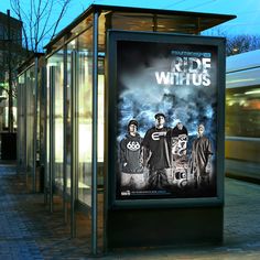 a bus stop with a poster on it