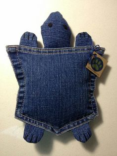 a stuffed animal in the back pocket of a jean bag