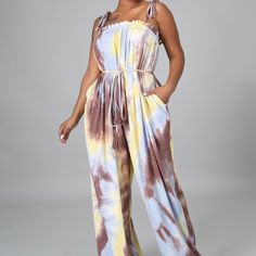 This Sleeveless Jumpsuit Features A Beautiful Tie Dye Print On Ribbed Stretchy Material. Featuring Self Tie Closures, Pockets, And An Elastic Waistband. (Shirt On Model Is Not Included) Fabric: 70% Cotton 25% Polyester 5% Spandex Sizing: Oversized. Feel Free To Size Down Color: Yellow/Brown Bandage Jumpsuits, Jumpsuit Casual, Tie Dye Jumpsuit, Brown Tie, Casual Rompers, Tie Dye Designs, Pink Tie Dye, Casual Design, Casual Jumpsuit