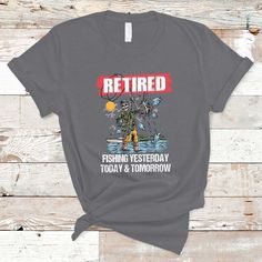 a t - shirt that says retired fishing today and tomorrow on the front, with an image of a man holding a fish