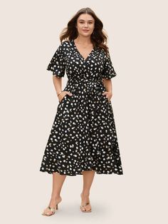 Allover Print Wrap Flutter Sleeve Midi Dress – BloomChic Chic Knee-length Floral Dress For Brunch, Chic Floral Short Sleeve Dress For Brunch, Summer Dress With Ruffle Hem And Butterfly Sleeves, Summer Dresses With Ruffle Hem And Butterfly Sleeves, Casual Ruffle Sleeve Maxi Dress For Day Out, Chic Butterfly Sleeve Dress For Day Out, Casual Midi Dress With Ruffle Sleeves For Vacation, Floral Ruffled Sundress With Short Sleeves, Spring Midi Dress With Ruffles And Butterfly Sleeves