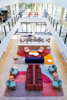 an overhead view of a lobby with couches and tables