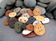 a pile of buttons sitting on top of rocks