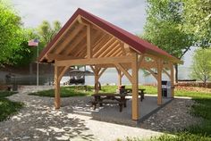 a picnic shelter with benches and an american flag in the background