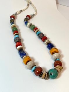 Multi Color & Texture Red Blue Green - Turquoise Bone Agate Coral Stone Clay Bead Necklace - Santa Fe / Southwest Chic OOAK Bone, Shell, Coral, Lapis Lazuli, African Turquoise, Amber Agate, Vein Agate, Coral, Jasper, Mixed Metals and more. Measures approximately 24 inches Lobster closure Boho, Southwest, Santa Fe Chic, Country Chic, Global World, African, Cowgirl, Ethnic, Earthly Natural Luxury Necklace Bohemian Turquoise And Red Coral Beaded Necklace, Southwestern Multi-strand Colorful Beads Necklace, Southwest Chic, Coral Red Multi-strand Beaded Necklaces, Southwestern Style Hand-strung Blue Beaded Necklaces, Multi-strand Red Coral Beaded Necklaces With Polished Beads, Natural Luxury, Clay Bead Necklace, Luxury Necklace