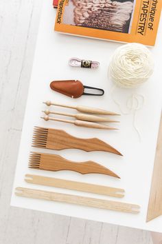 knitting supplies laid out on top of a table