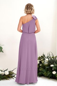 the back of a bridesmaid's dress in coral