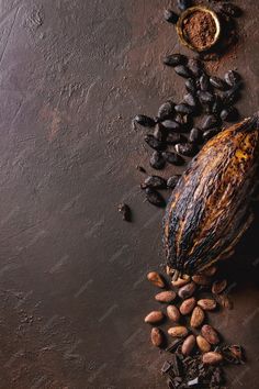 nuts and cocoa on a dark surface