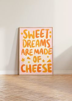 an orange and yellow poster with words on it that says sweet dreams are made of cheese