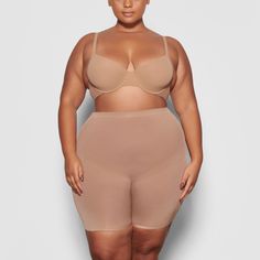 A mid-thigh short with deep low back that makes it perfect backless shapewear option for low cut clothing. Smooths and sculpts thighs and hips with silky smooth compression. Backless Shapewear, Mid Thigh Shorts, Low Back Dresses, Cut Clothes, Back Wedding Dress, Silk Skirt, Nice Shorts, Medium Brown, Low Back