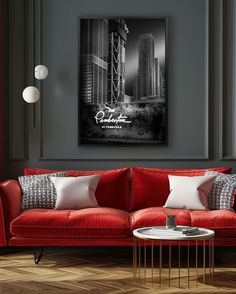 a living room with red couches and white pillows