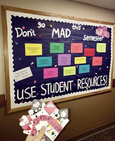 a bulletin board with post it notes attached to it and someone holding up a piece of paper that says don't mad, use student resources