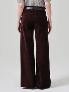 Amy Says... The Lolli features an ultra-flattering mid-rise waist that sits higher up on the hip with an easy, relaxed wide leg. The 32" inseam lengthen the leg for a look that can be easily dressed up or down. Looks Like: Saturated burgundy with a finished hem. Feels Like: Stretch velvet with a super smooth hand. This fit is true to size. Closure: Zip Fly Rise: 11" Inseam: 32" Leg Opening: 24 1/2" Model is 5'10" and wearing a size 27 Wash: Burgundy Fabric: 54% Cotton 44% Rayon 2% Spandex Made i High Waist Burgundy Wide Leg Pants For Fall, Burgundy High Waist Wide Leg Pants For Fall, Burgundy Wide Leg Pants For Fall Workwear, Wide Leg Burgundy Pants With Pockets, Burgundy Wide Leg Pants With Pockets, Burgundy Wide-leg Pants With Pockets, Burgundy Cotton Wide Leg Pants, High-rise Pants With Loosely Fitted Hips For Fall, Relaxed Fit Bottoms For Fall