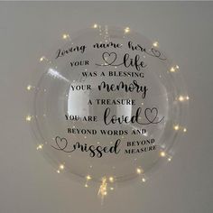 a lighted glass ornament with the words loving name here, your life was a blessing