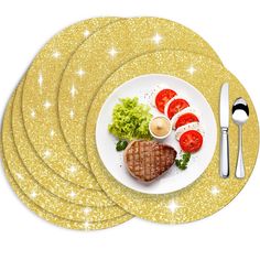 a white plate topped with steak, tomatoes and lettuce next to silverware