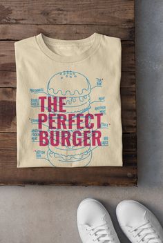 Keywords: UNISEX Vintage Perfect Burger T-Shirt, Food Hoodie, Funny Meme Sweater, Aesthetic Foodie Tee, BBQ Dad Top, Trendy Shirt, Gift For Burger Lover, Graphic Tee  ------------------------------------------------ QUALITY This T-shirt is a UNISEX t-shirt with a vintage illustration and it feels soft and light, with just the right amount of stretch. It features a crew neck, pre-shrunk fabric and side-seamed fit. FIND YOUR SIZE Please find the fitting guide in the pictures to determine your size Tshirt Illustration Design, Food Shirt Design, Stamp Shirt, Pizza T Shirt, Food Lettering, Vintage Tshirt Design, Perfect Burger, Vintage Shirt Design