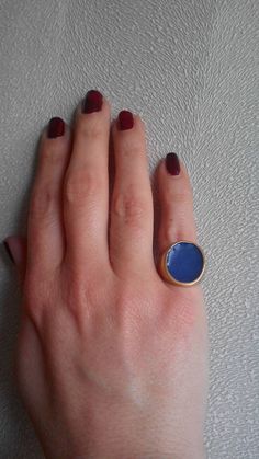 A handmade signet ring cover with 18kt gold .Made with silver 925 and blue color inlay.  Any customization in the color is welcome. Blue Enamel Ring With Polished Finish, Blue Enamel Polished Round Ring, Blue Polished Enamel Ring, Blue 14k Gold Enamel Ring For Formal Events, Blue 14k Gold Enamel Ring For Formal Occasions, Blue Enamel Ring With Polished Finish As Gift, Blue Enamel Ring With Polished Finish For Gift, Formal Blue Enamel Ring In 14k Gold, Blue Oval Enamel Rings