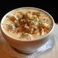 a white bowl filled with soup on top of a table