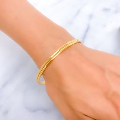 This exquisite pair of 22k gold bangles weighs a total of 17.7 grams and features a radiant classic dotted design. The yellow gold finish highlights their elegant simplicity, making them perfect for any occasion. With a bangle size of 2.8 and an opening diameter of 2.5 inches, they provide a comfortable and stylish fit. Ideal for those who appreciate timeless beauty and understated elegance, these bangles are suitable for both everyday wear and special events. Their classic dotted pattern and high-quality craftsmanship make them a cherished addition to any jewelry collection. PRODUCT DETAILS Gold Purity(karat): 22k Gold Weight(grams): 17.7 Item Finish: Yellow Gold Bangle Size: 2.8 Bangle Opening(diameter): 2.5" Number Of Pieces: 2 Bangles Gold Bangle Bracelet With Simple Design, Gold Simple Design Bangle Bracelet, Elegant Gold Bangle With Simple Design, Classic 22k Gold Bracelets As A Gift, Classic 22k Gold Bracelet As A Gift, Dainty Yellow Gold-plated Bangle, Dainty Yellow Gold Plated Bangle, Dainty Yellow Gold Jubilee Bracelet Bangle, Dainty Yellow Gold Bangle With Jubilee Bracelet