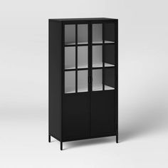 a black cabinet with glass doors and shelves