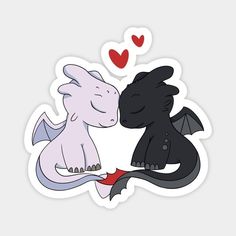 two cute little black and white dragon stickers with hearts on the back, one is facing each other