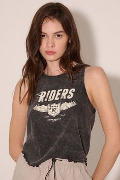 Mineral washed graphic tank top. Vintage-style "Riders" text print with wing shield graphic. Crew neckline. Sleeveless. Curved hem with lettuce-edge detailing. Racerback. Cropped length. Relaxed fit. 100% Cotton. Imported top designed and printed in LA. Model wears size S. Casual Washed Black Sleeveless Tank Top, Casual Washed Black Crew Neck Tank Top, Sporty Washed Black Top With Graphic Print, Grunge Crew Neck Tank Top With Letter Print, Washed Black Sleeveless Top For Streetwear, Sleeveless Washed Black Top For Streetwear, Casual Sleeveless Muscle Tee With Screen Print, Casual Washed Sleeveless Muscle Tee, Casual Acid Wash Crew Neck Tank Top