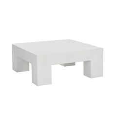 a white coffee table sitting on top of a white floor