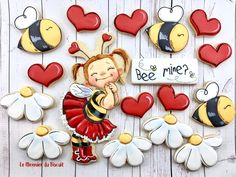 decorated cookies with the words bee mine on them and hearts in the shape of flowers