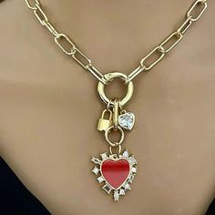 A beautiful 14k gold plated over brass, open link, Paperclip chain necklace . The chain holds 3 stunning Charms which are attached to a gold spring ring clasp. Charms- 1. A large red enamel and cubic zirconia enamel heart pendant. 2.A large heart shaped cubic Zirconia stone charm. 3.Gold padlock charm Wear alone or layer with other necklaces to change up the look. Perfect layering necklace. Tips to keep your jewelry looking good. 1) Keep jewelry away from water and chemicals. 2) Remove during ph Clean Packaging, Paperclip Chain Necklace, Large Heart, Stone Gold, Layering Necklace, Stone Heart, Box Gift, Keep Jewelry, Physical Activities