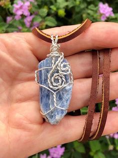 This beautiful Raw Blue Kyanite Blade is wrapped in non-tarnish Silver-plated Copper wire.  Pendant measures approximately 2 inches long from the top of bail to the bottom tip of stone & is a little under an inch wide.  Pendant includes a durable, newly assembled (assembled by me) Black or Brown Leather necklace available in lengths of 16-24 inches. 👆You will receive this exact pendant                       ❤️Kyanite❤️ Astrological signs of Taurus♉️, Libra♎️, & Aries♈️  Kyanite is one of the st Wire Wrapped Sodalite Jewelry As Gift, Libra Aries, Brown Leather Necklace, Natural Pain Relievers, Astrological Signs, Tarnished Silver, Meditation Stones, Wire Pendant, Blue Kyanite